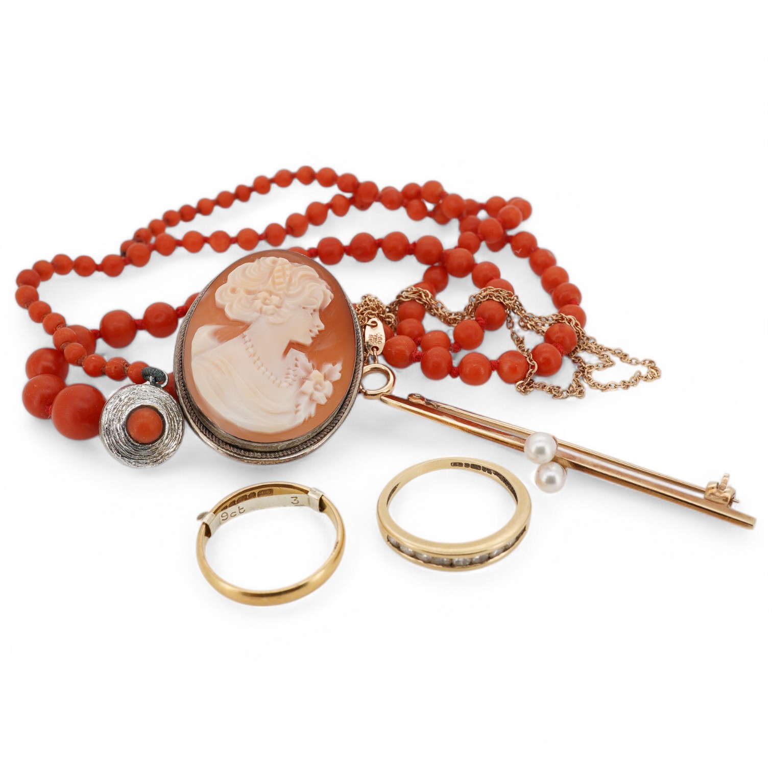 A small group of assorted jewellery including a 22ct gold wedding band, a modern 18ct gold and channel set diamond half eternity ring, a 9ct and two stone cultured pearl set bar brooch, a graduated coral bead necklace an